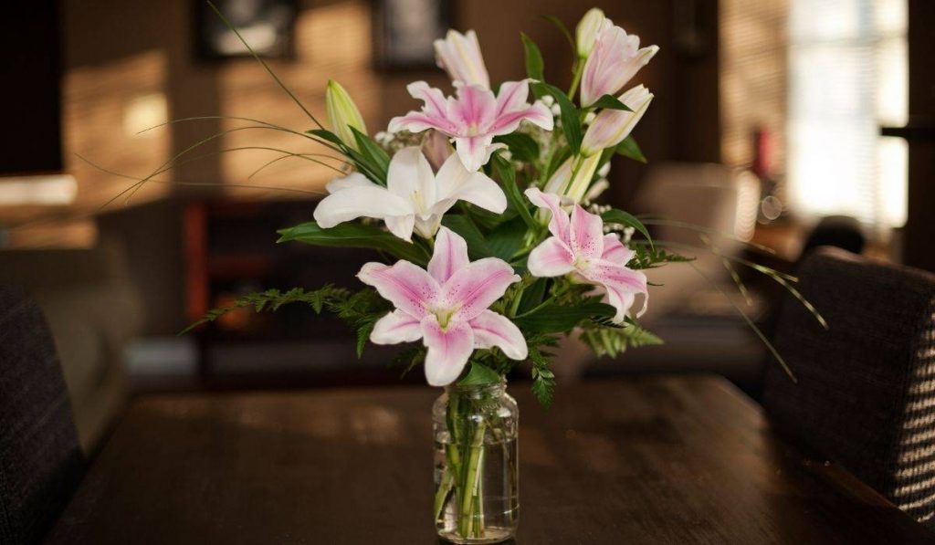 bouquet of lilies on table in funeral home